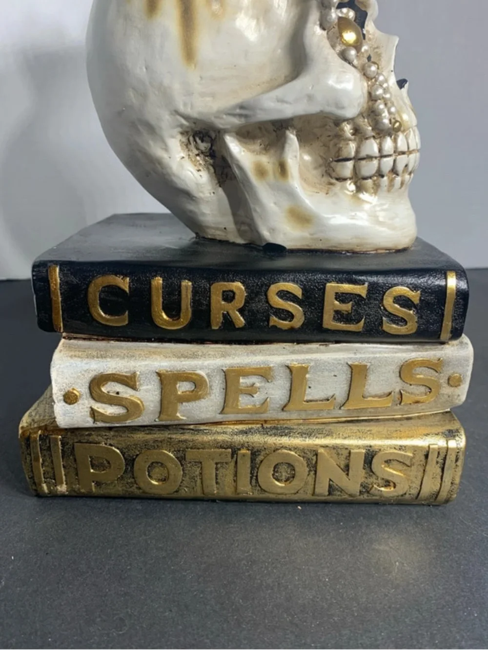 Decorative White and Gold Skull on Stacked Spell Books - Home Accent